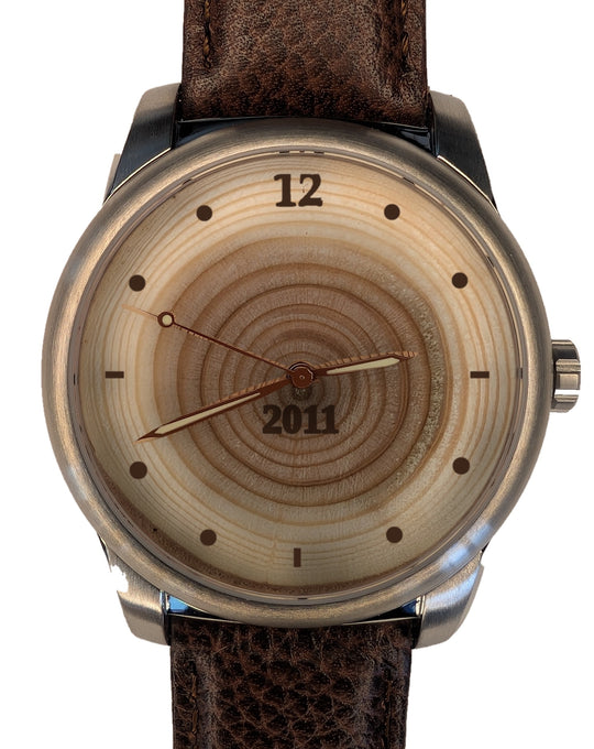 Wood watch with 15 tree rings, origin year 2011 burned on the dial