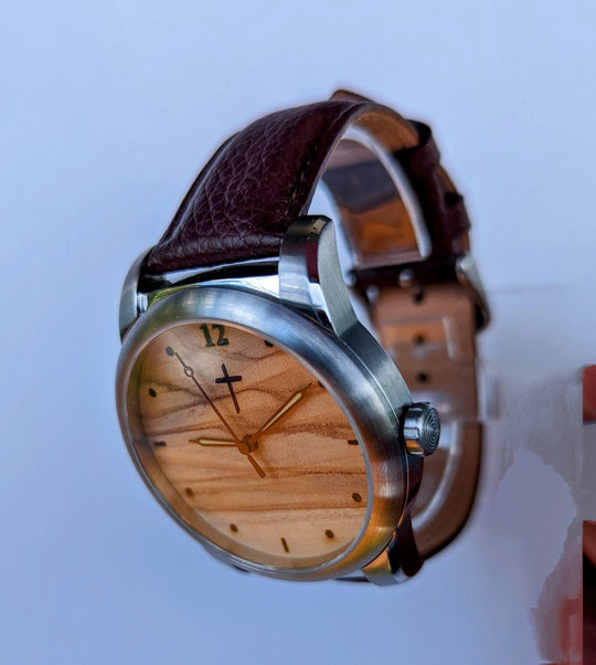 Custom watch with olive wood dial and leather strap, featuring a compartment for cremation ashes, perfect memorial gift.