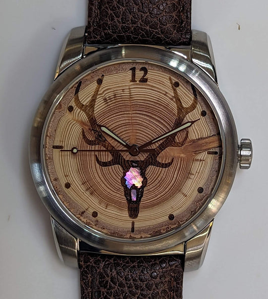 Tree Ring-Elk Watch featuring Douglas-fir dial and Mother of Pearl inlay, showcasing unique annual growth rings.