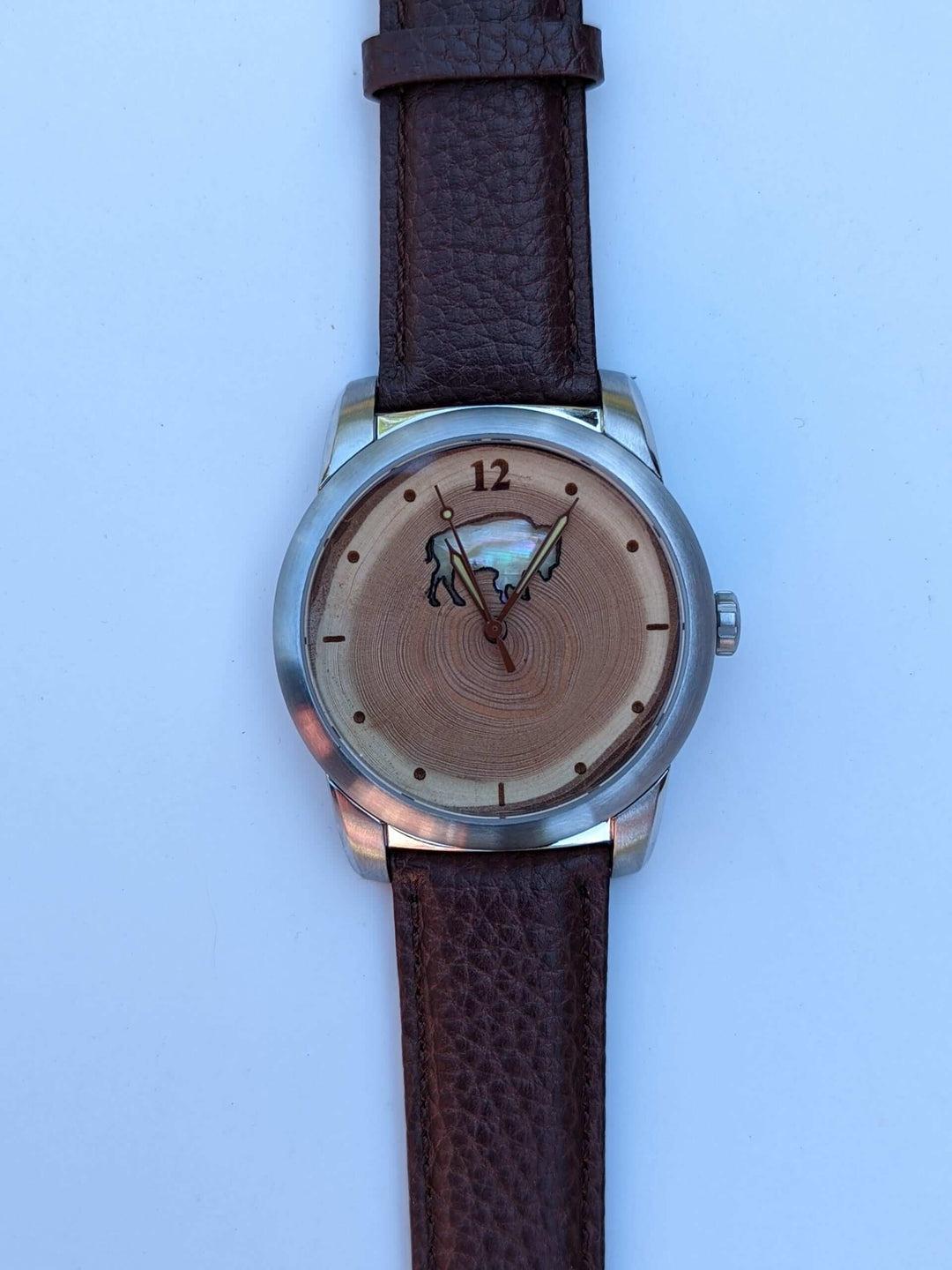 Colorado Bison gift watch featuring Mother of Pearl inlay and wood dial, showcasing unique tree rings.